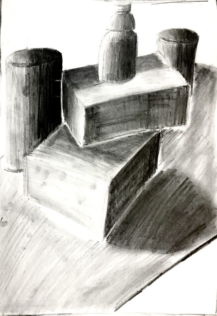 This is a charcoal drawing of two cylinders, and a Gatorade bottle which is standing on top of two boxes. The drawing is shaded with the source of light shining from the left.