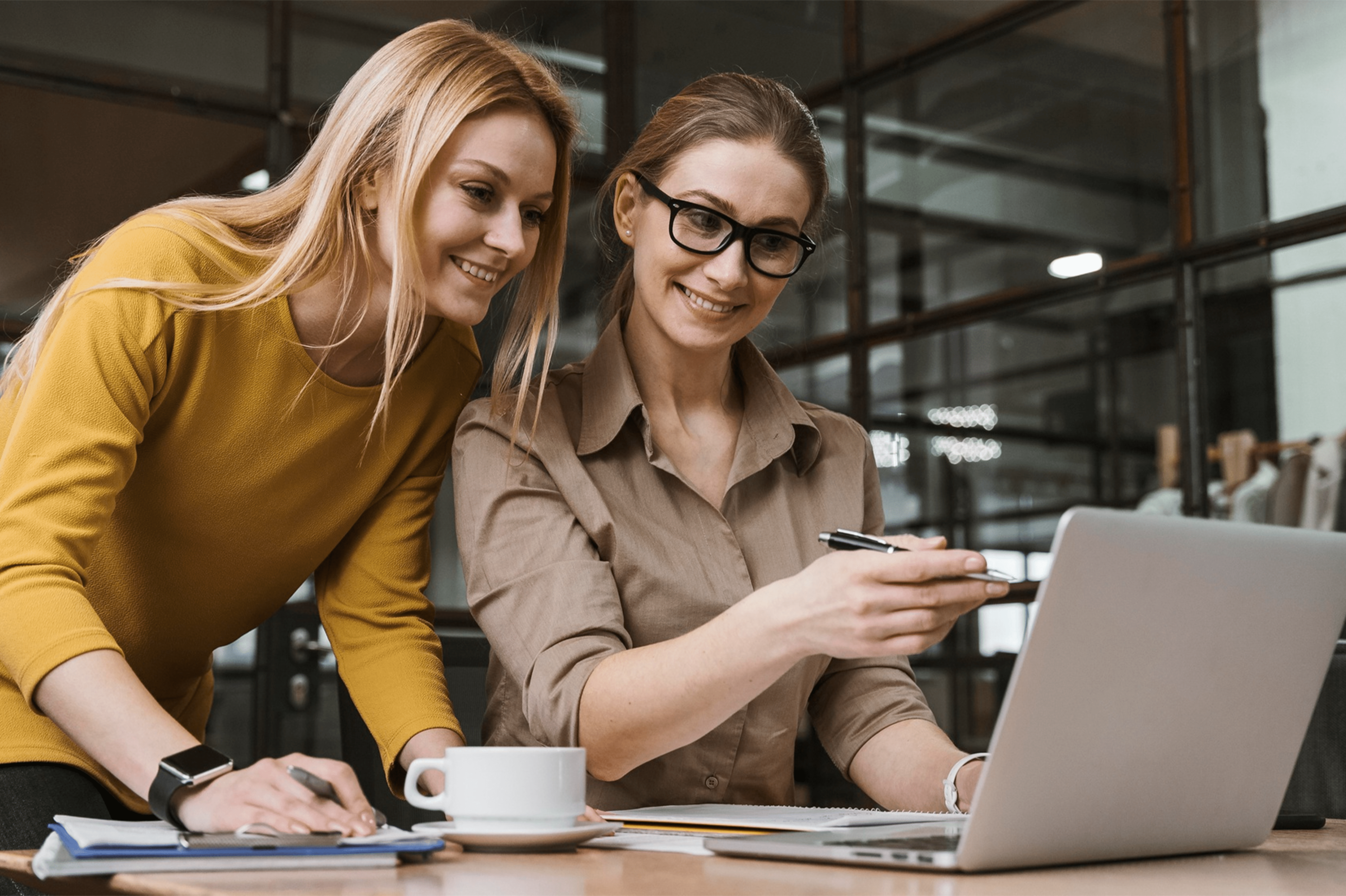 A woman consulting another woman on a project